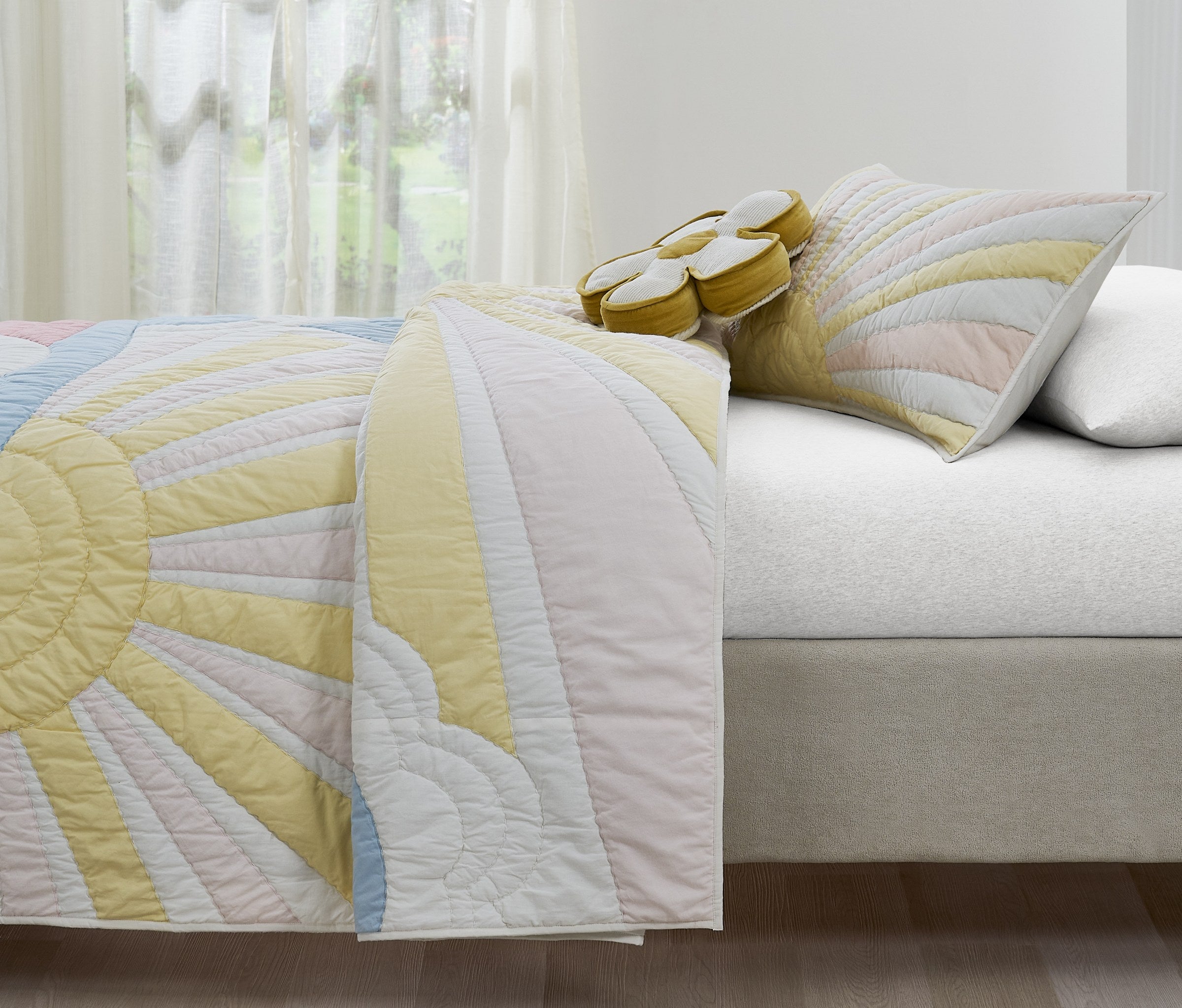 Sunrise Glow kids AC quilt styled in a bedroom
